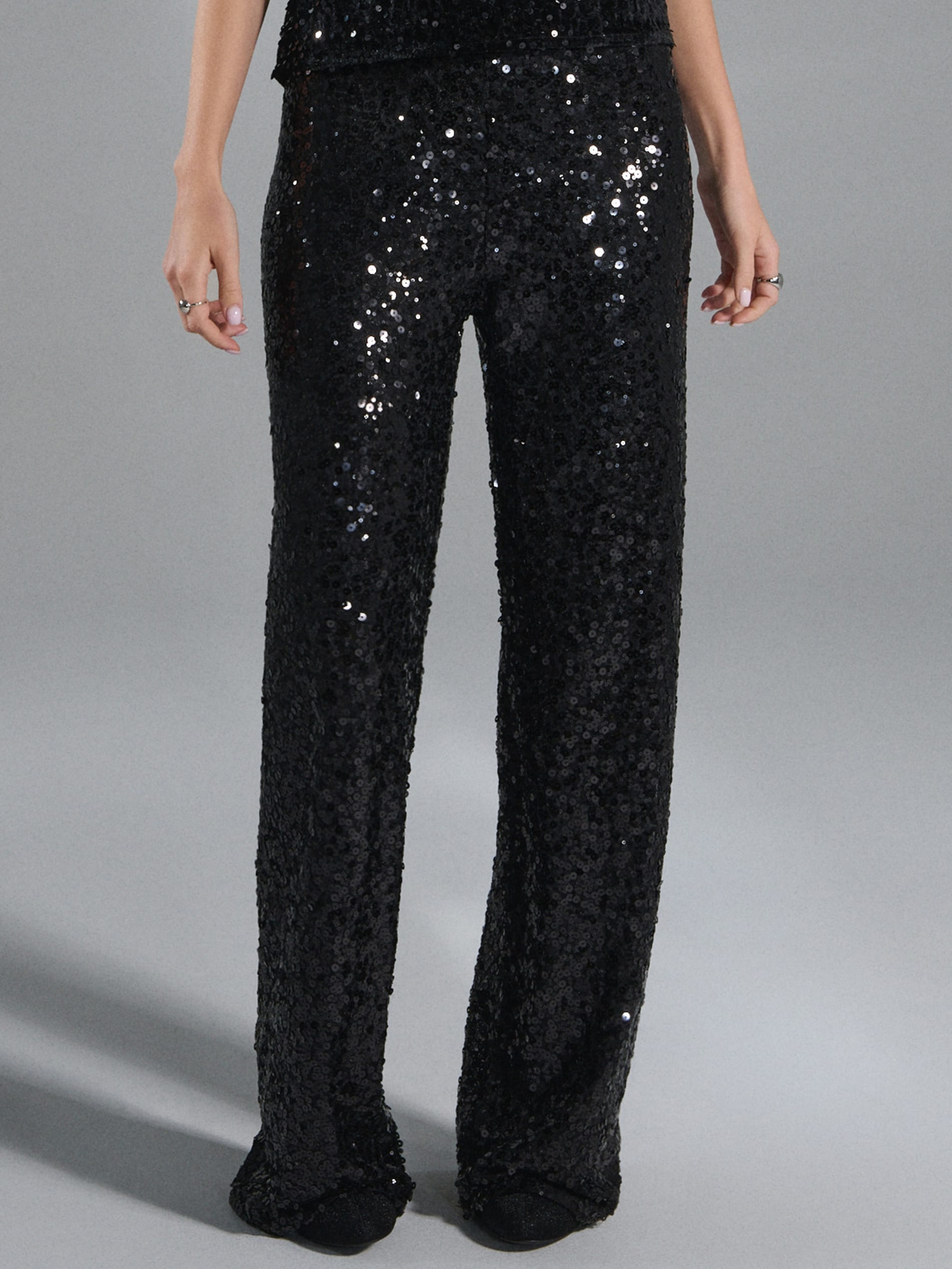 Sinsay - Spodnie wide leg z błyszczącymi cekinami - czarny