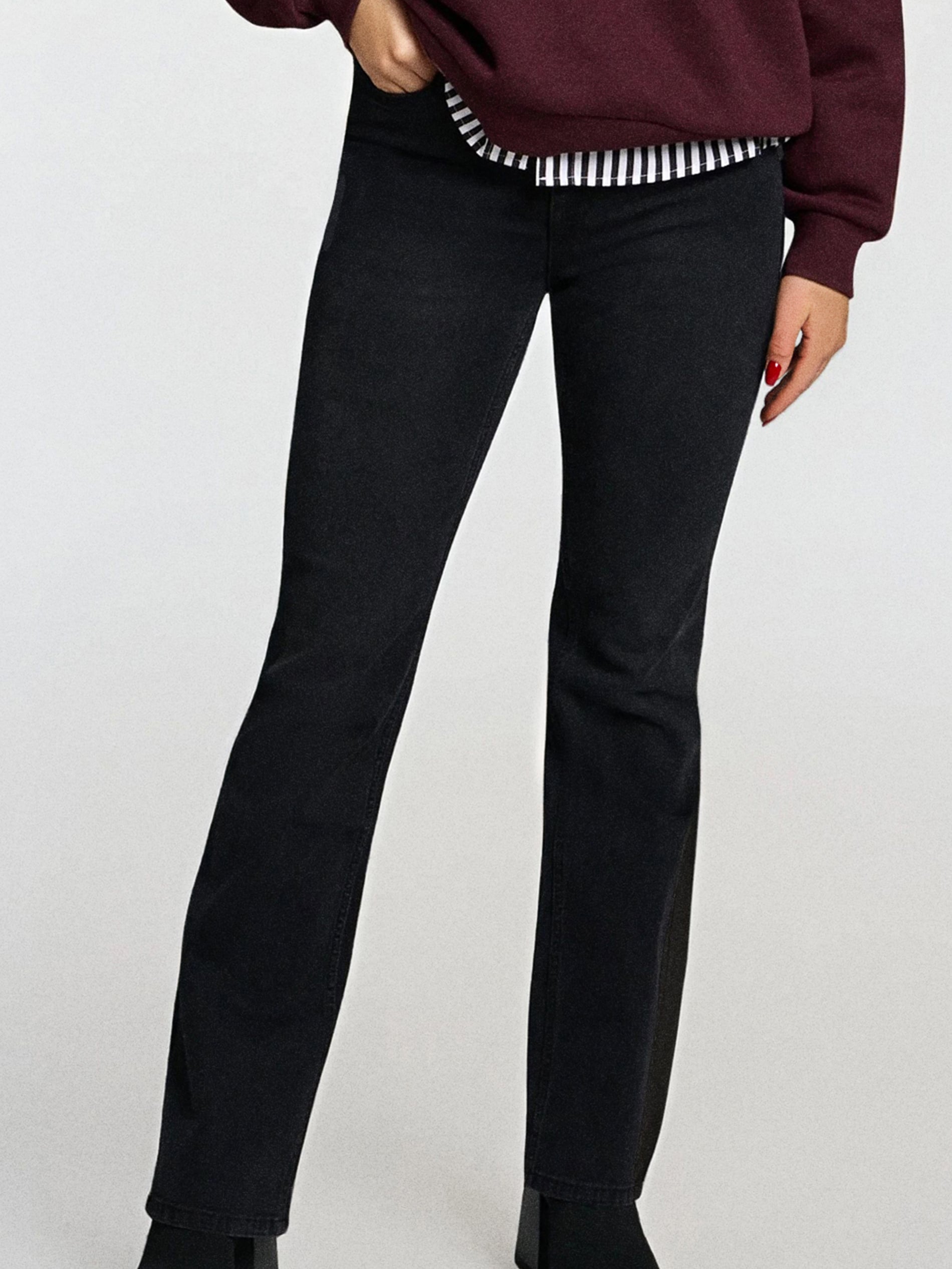 Sinsay - Spodnie jeansowe flare - czarny