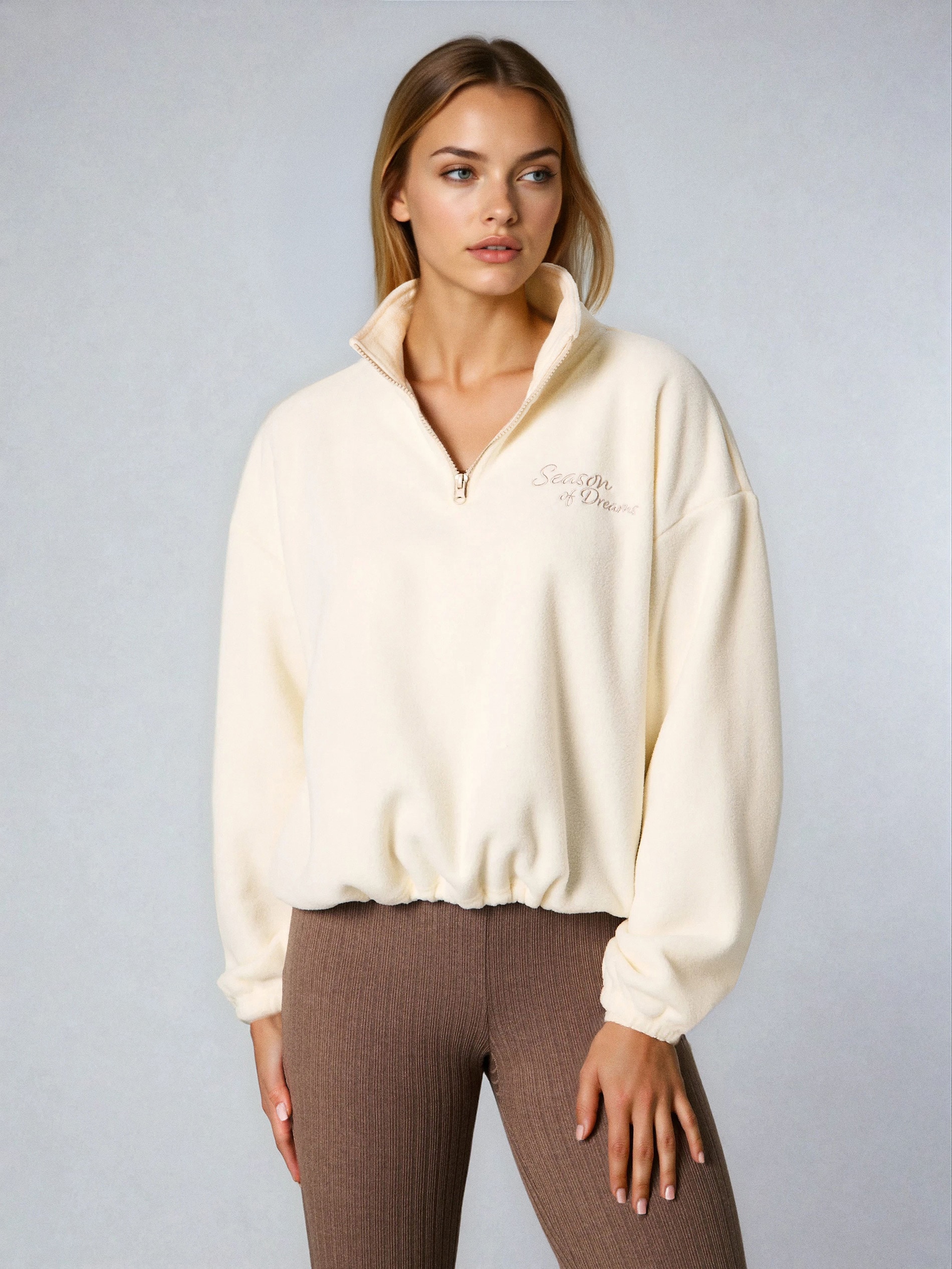 Sinsay - Φλις μπλούζα με κοντό φερμουάρ και ρυθμιζόμενο τελείωμα με στοπ - κρεμ φωτογραφία