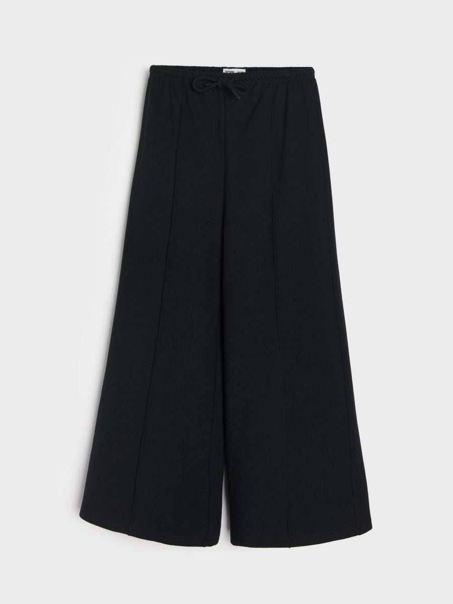 Pantaloni evazați cu cusături decorative - negru - SINSAY