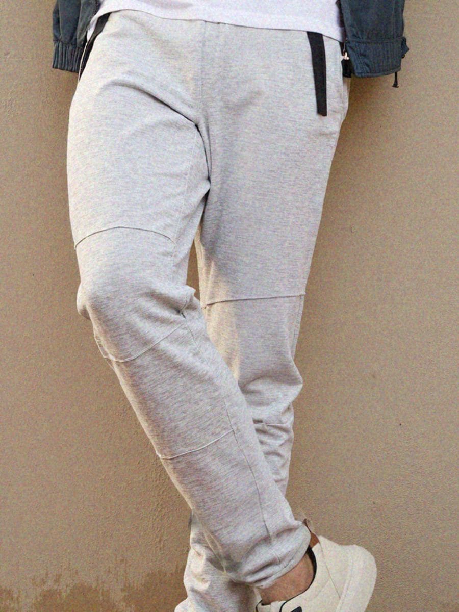 Pantaloni de trening tip jogger - gri deschis - SINSAY