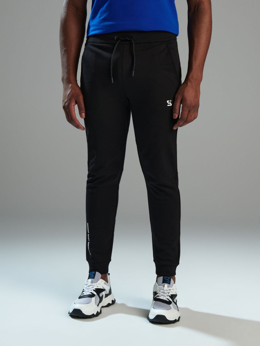 Pantaloni de trening slim jogger - negru - SINSAY