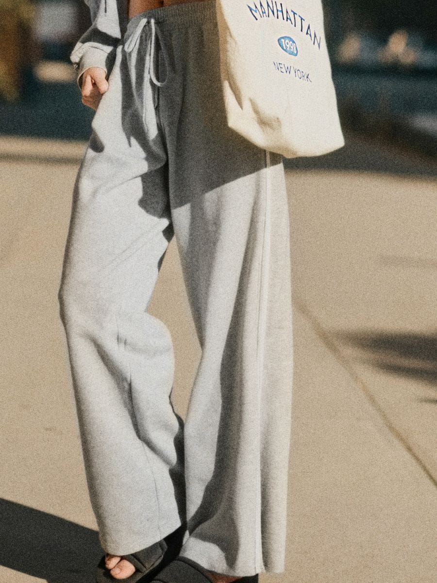 Dressipüksid laiade säärte ja küljetriipudega - helehall - SINSAY