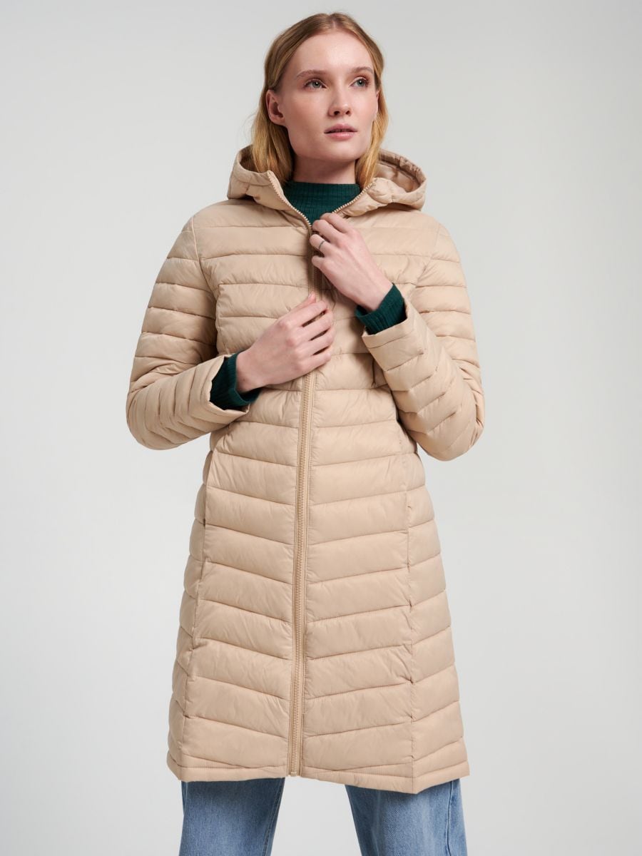 Prošívaný kabát s kapucí - krémová - SINSAY