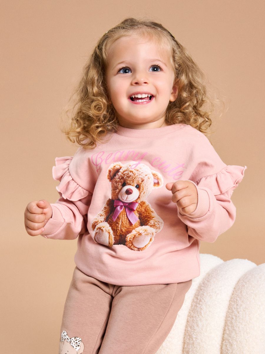 Pulover z volančki na rokavih - pastelno roza - SINSAY