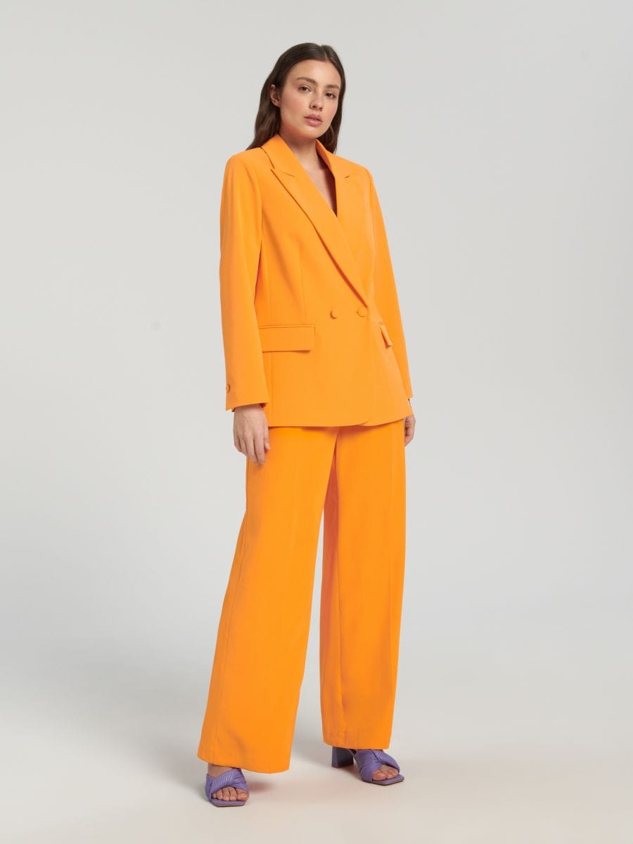 Kostiuminės kelnės - šviesiai oranžinė - SINSAY