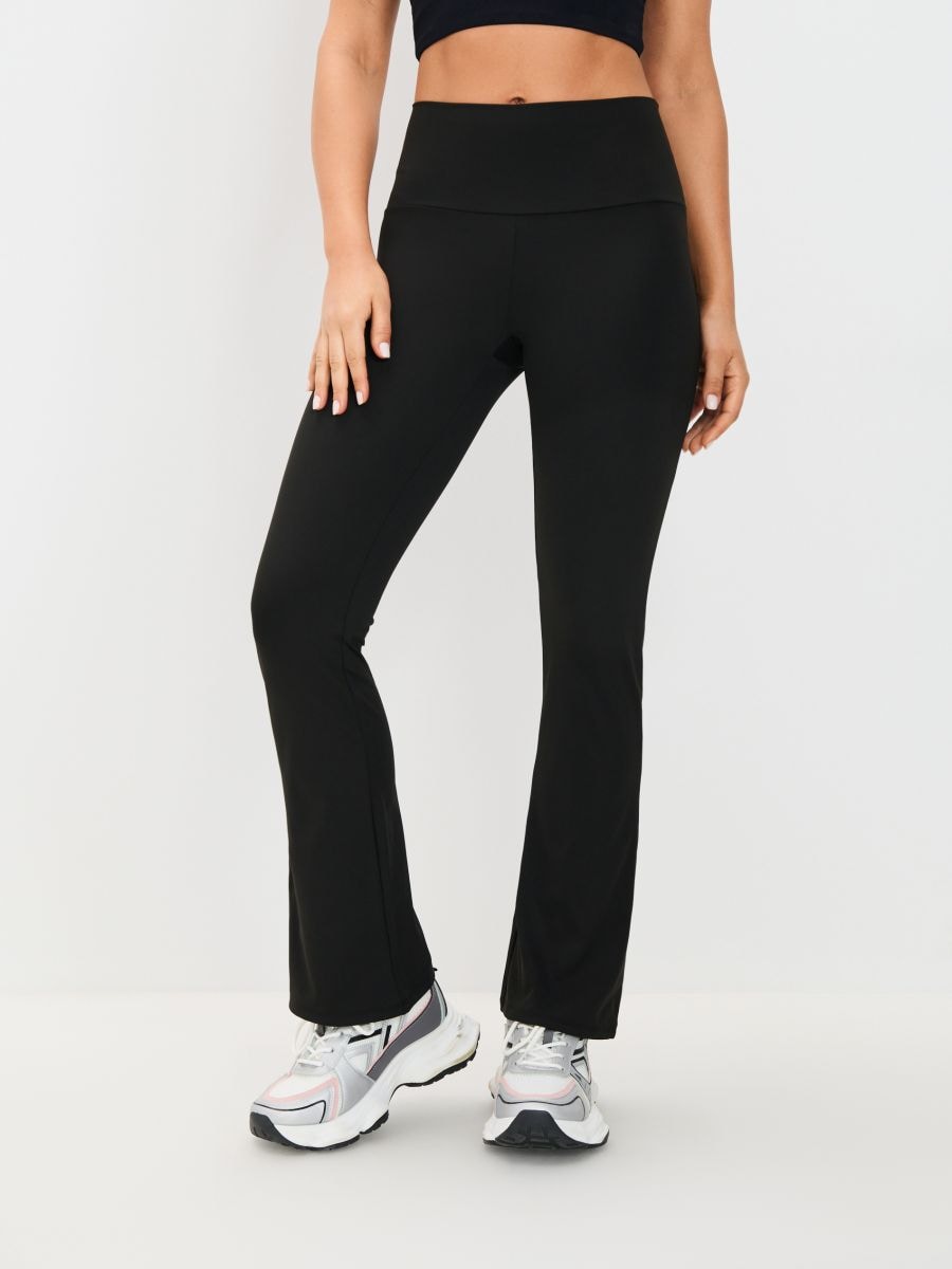 Legginsy flare GYM HARD - czarny - SINSAY