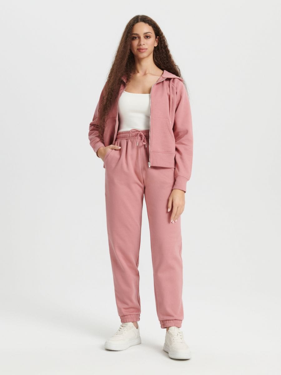 Pantaloni sport - roz-piersică - SINSAY