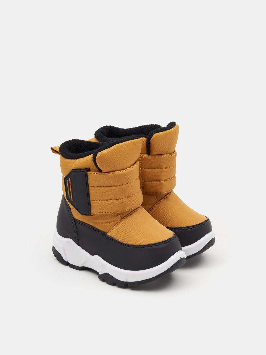 Snow boots - amber - SINSAY