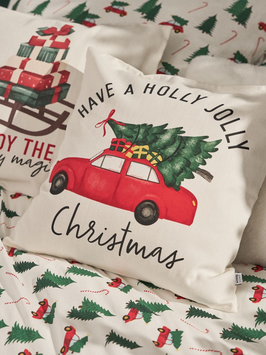 Poszewka na poduszkę z motywem świątecznym - kremowy - SINSAY