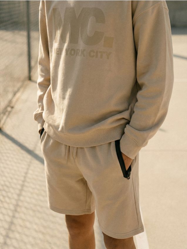 Sinsay - Pantaloni scurți cu buzunare cu fermoar - bej