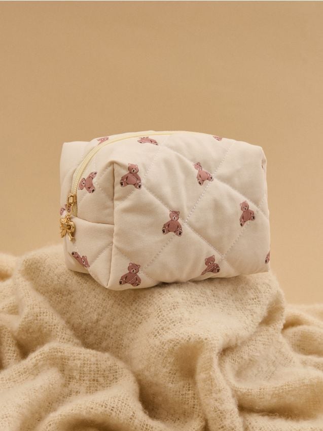 Sinsay - Prešívaná kozmetická taštička - krémová