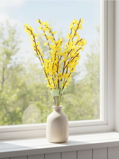 Dekoratiivne taim forsüütia oksa kujul