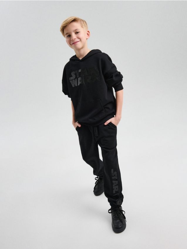 Sinsay - Spodnie z błyszczącym silikonowym nadrukiem Star Wars - czarny