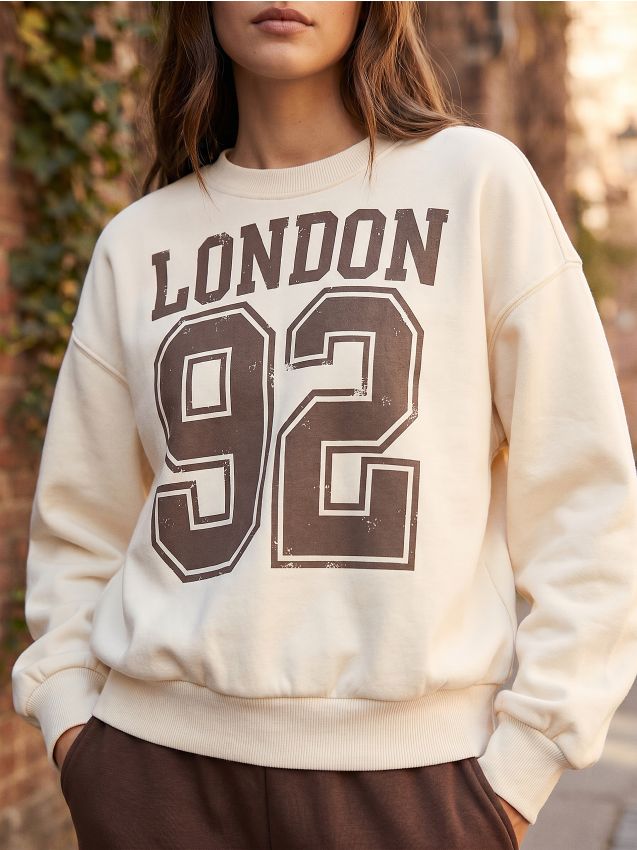 Sinsay - Bluză crewneck cu inscripție - crem