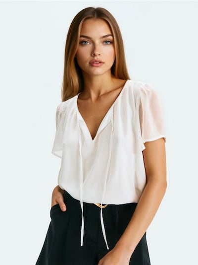 Blusa con maniche in tulle