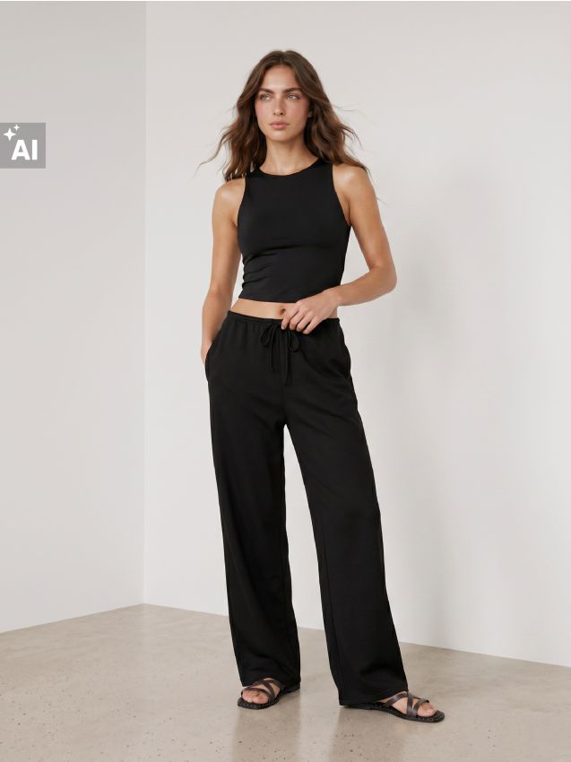 Sinsay - Pantaloni de trening cu crac larg - negru