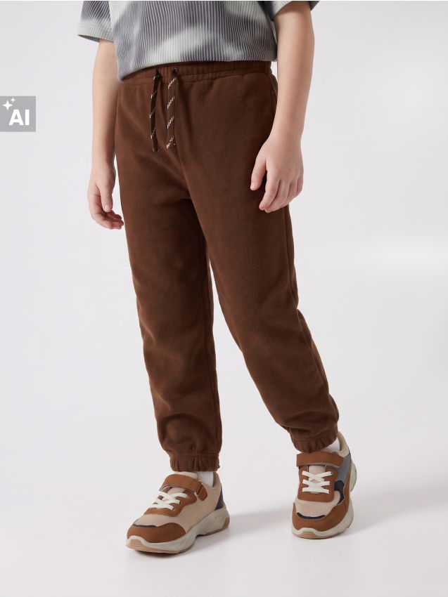 Sinsay - Pantaloni jogger lejeri din fleece - maro