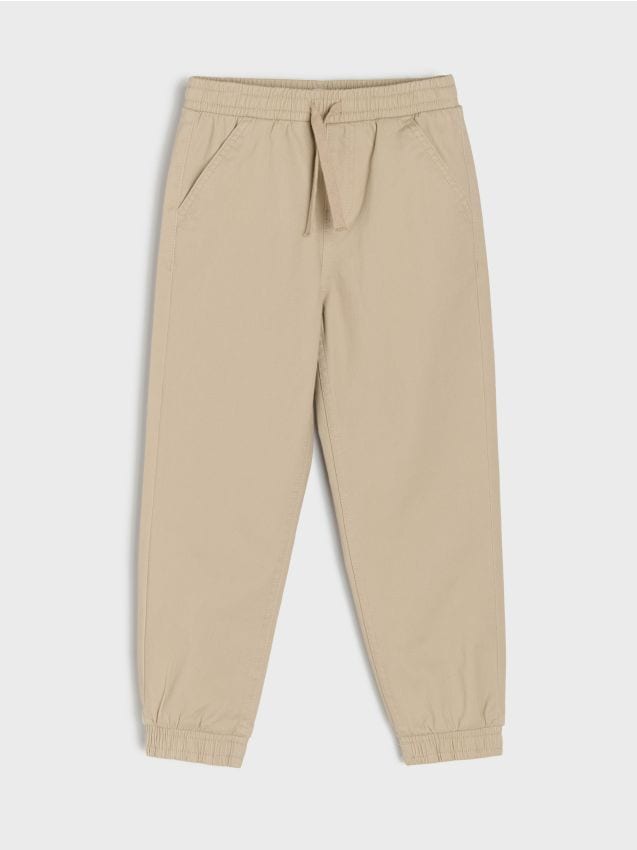 Sinsay - Spodnie joggery slim z twillu o miękkim wykończeniu - beżowy