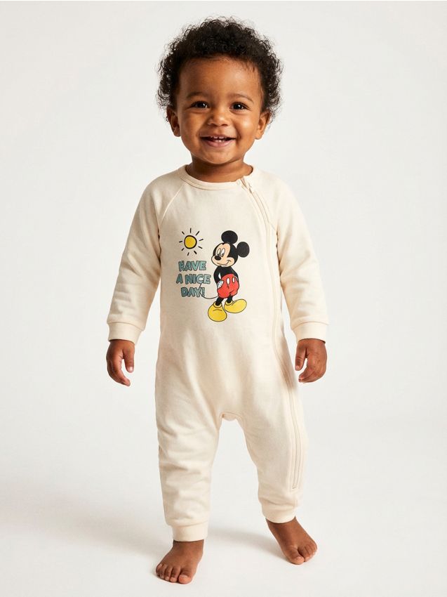 Sinsay - Salopetă din bumbac pentru bebeluși Mickey Mouse - crem