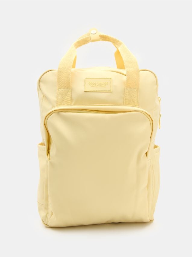 Sinsay - Podróżny nylonowy plecak z kieszenią na laptopa - kremowy