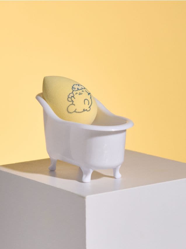 Sinsay - Burete de machiaj cu recipient în formă de cadă PomPomPurin - galben-deschis