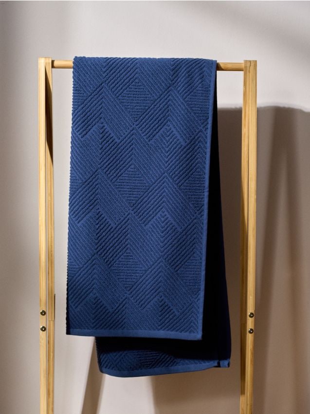 Asciugamano di cotone con motivo in rilievo - blu scuro