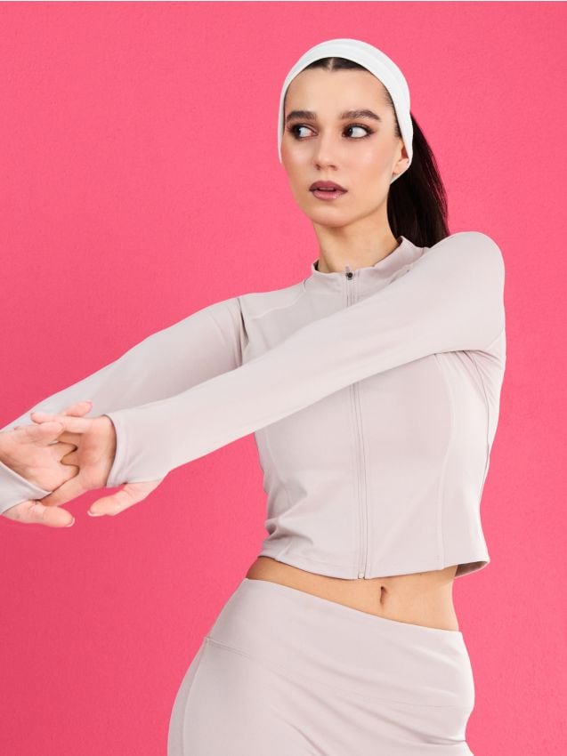 Sinsay - Rozpinana sportowa bluza ze stójką i otworami na kciuki Gym Hard - kremowy