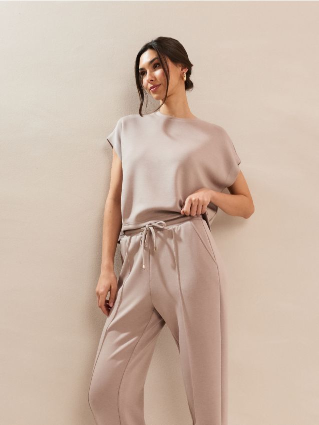 Sinsay - Pantaloni țigaretă din tricot scuba cu amestec de viscoză - galben-pal