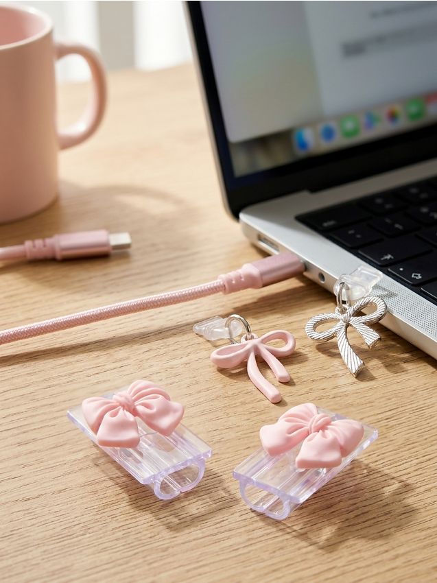 Sinsay - Set de protecții pentru cabluri și dopuri antipraf cu fundițe 4 pack - roz