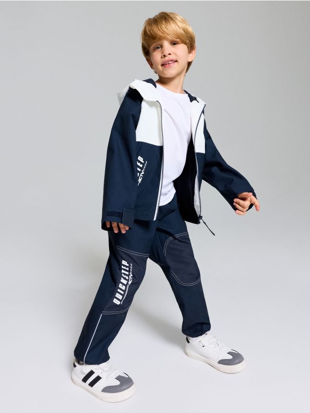 Sinsay - Pantaloni sport jogger cu elemente reflectorizante Active - bleumarin