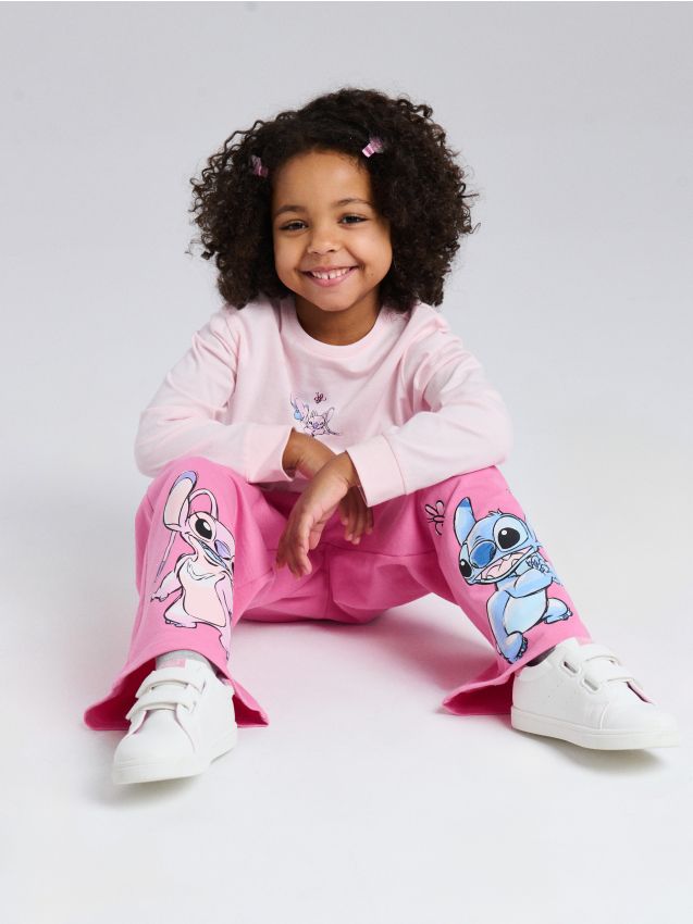 Sinsay - Spodnie dresowe wide leg z nadrukiem Stitch - różowy