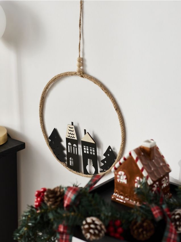 Decorazione natalizia a forma di corona rotonda con case e alberi - nero