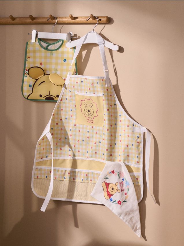 Sinsay - Șorț de bucătărie Winnie the Pooh - galben-deschis