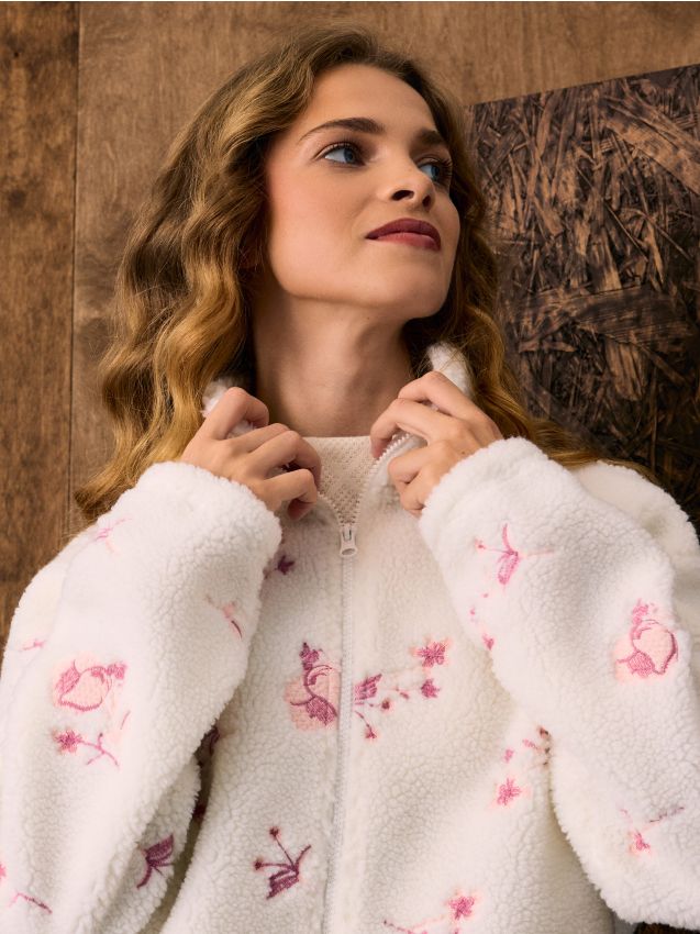 Sinsay - Bluză Sherpa cu fermoar și motiv floral - crem