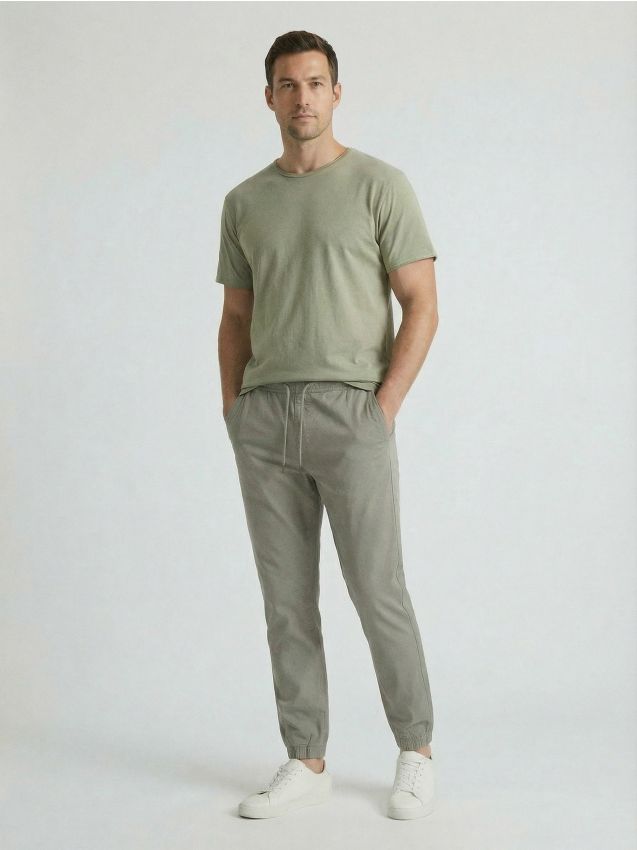 Sinsay - Pantaloni din bumbac jogger - verde-pal