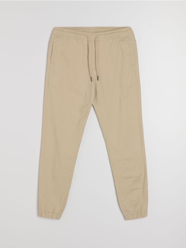 Sinsay - Bawełniane spodnie jogger - beżowy