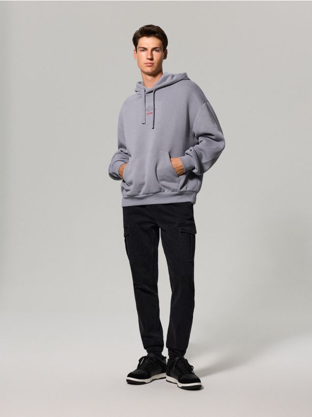 Sinsay - Jeansy jogger cargo z efektem sprania - czarny