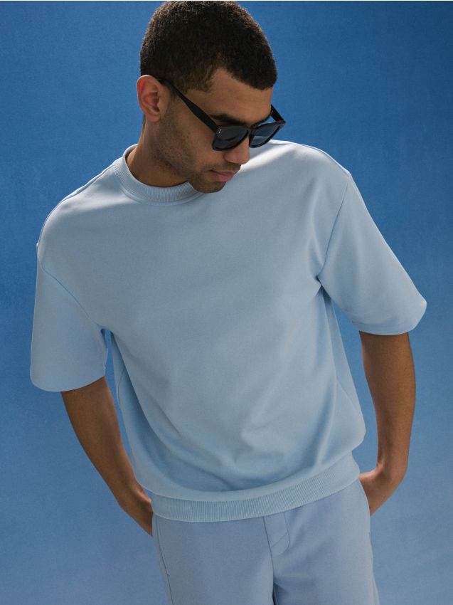 Sinsay - Bluză de trening din bumbac - albastru-pal