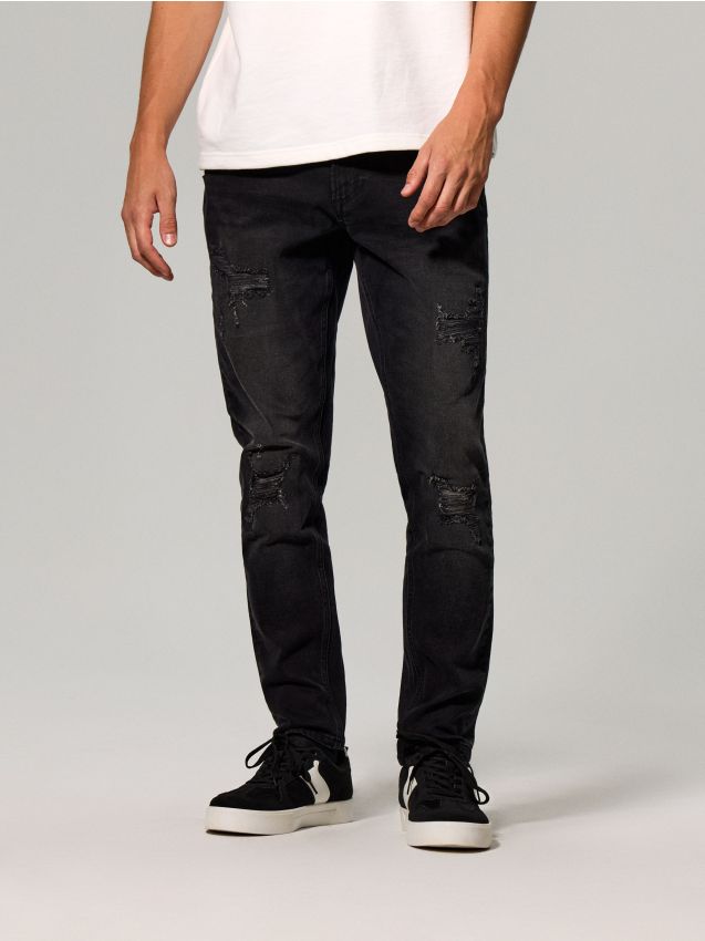 Sinsay - Blugi slim fit cu aspect uzat și efect prespălat - negru
