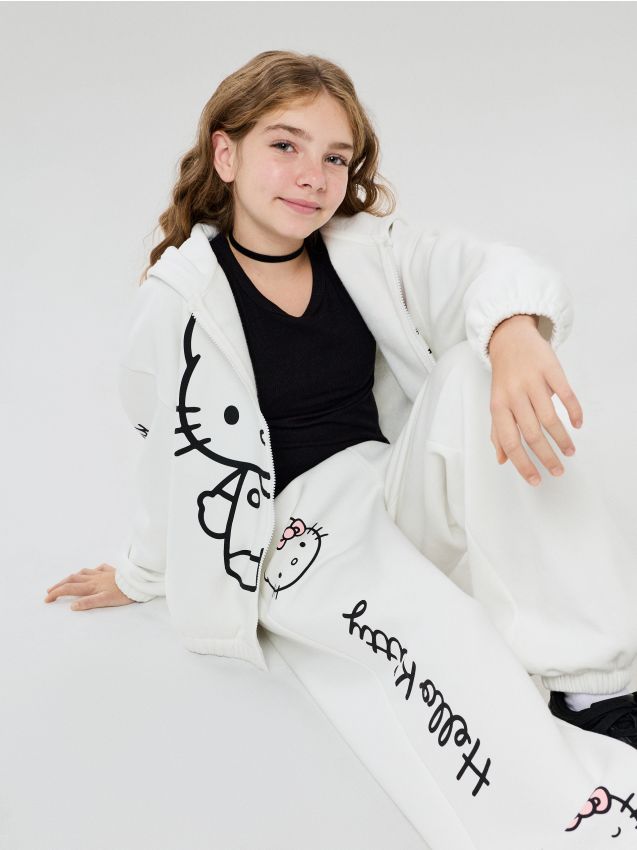 Sinsay - Pantaloni de trening oversize jogger cu imprimeu Hello Kitty - crem
