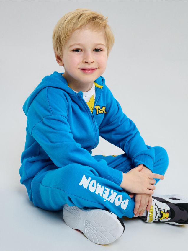 Sinsay - Spodnie dresowe jogger Pokemon - niebieski