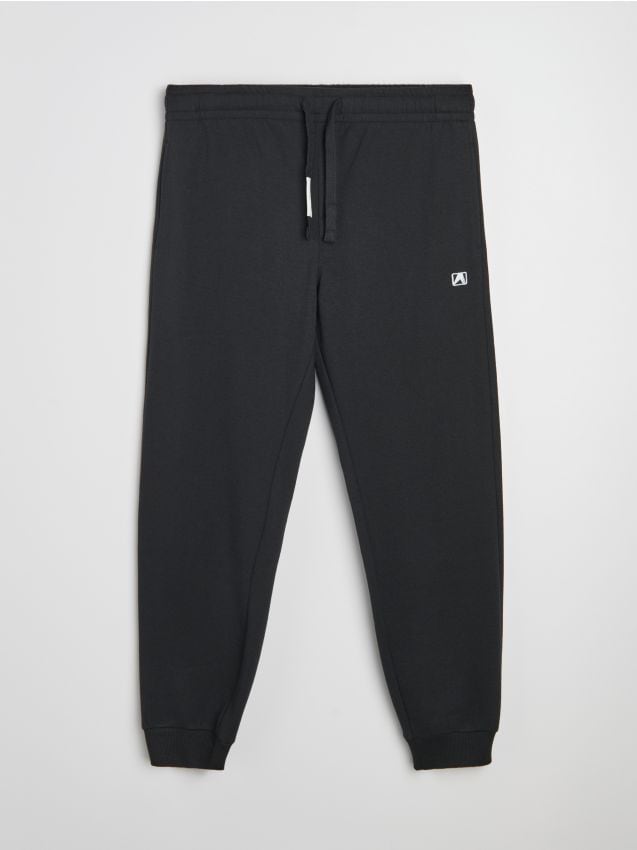 Sinsay - Pantaloni jogger de trening cu broderie - negru