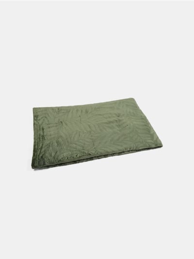 Coperta con motivo vegetale in rilievo