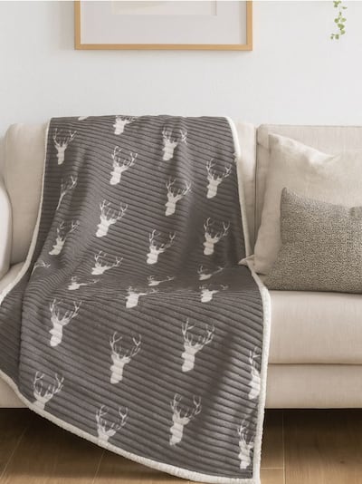 Bordázott karácsonyi pléd rénszarvas mintával