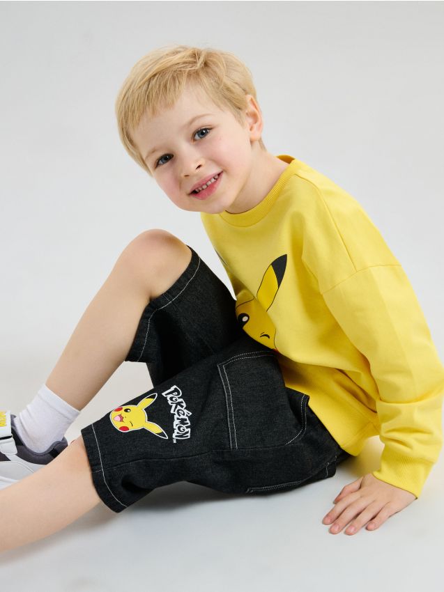 Sinsay - Bawełniane szorty bermudy Pokemon - czarny