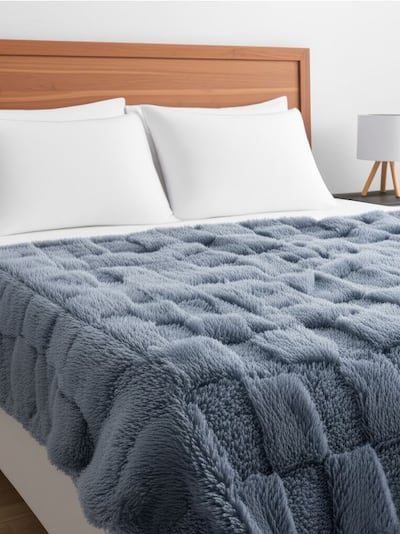 Coperta con motivo a scacchiera in rilievo