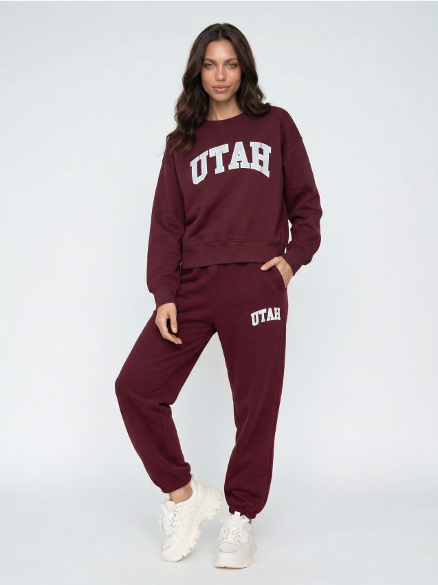 Sinsay - Pantaloni jogger din bumbac cu imprimeu UTAH - bordo