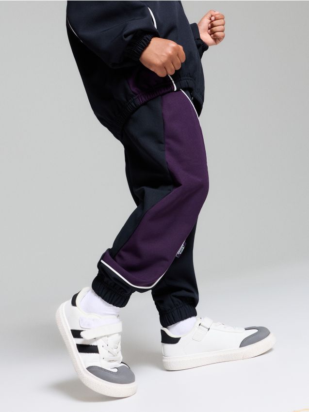Sinsay - Pantaloni sport relaxed fit cu vipușcă contrastantă Active - bleumarin