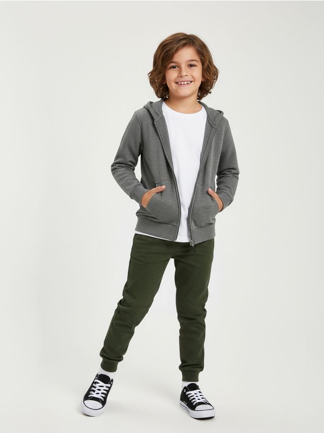 Sinsay - Jeansy jogger z efektem sprania - zielony